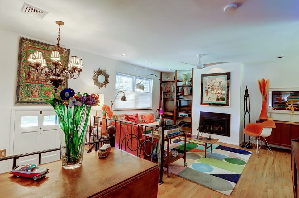 Marko Grove Open Plan Living Area with Gas Fireplace and MCM Furnishings