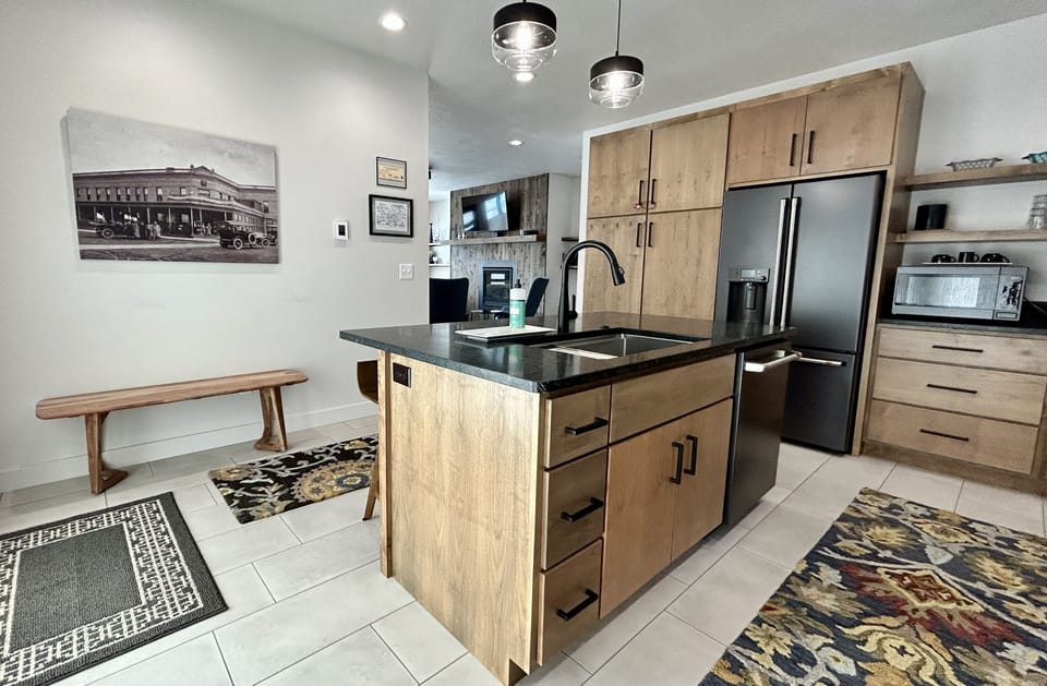 Large kitchen with beautiful appliances and soapstone counters.