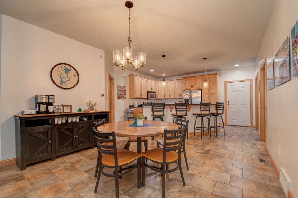 The 50" round custom-made dining table can seat 6. ALL lighting has dimmers.