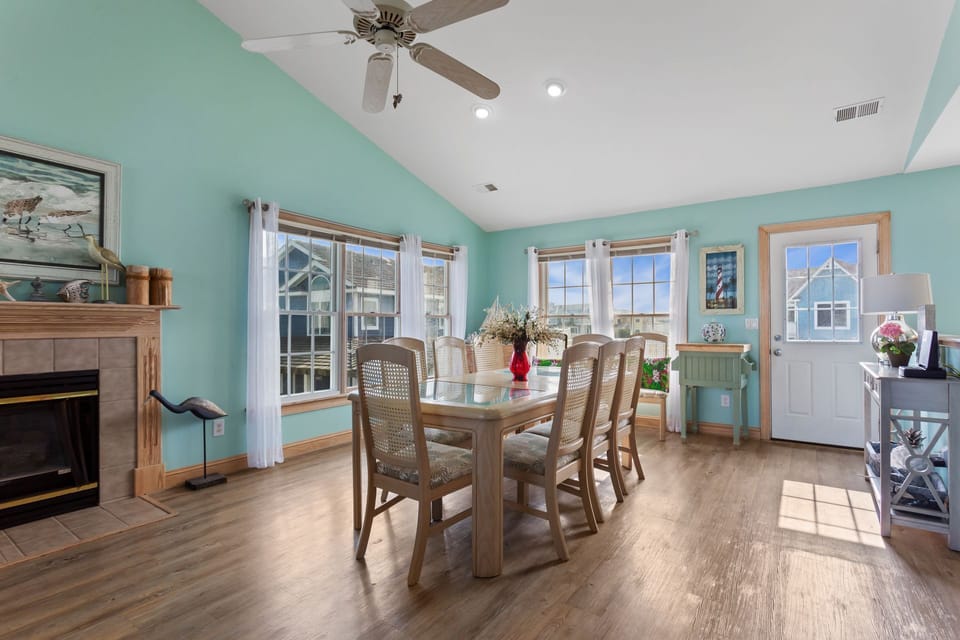 The open-concept Dining Area with seating for 8 ensures fun conversation and lots of sunlight as everyone eats together.