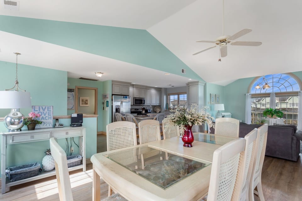 The open-concept Dining Area with seating for 8 ensures fun conversation and lots of sunlight as everyone eats together.