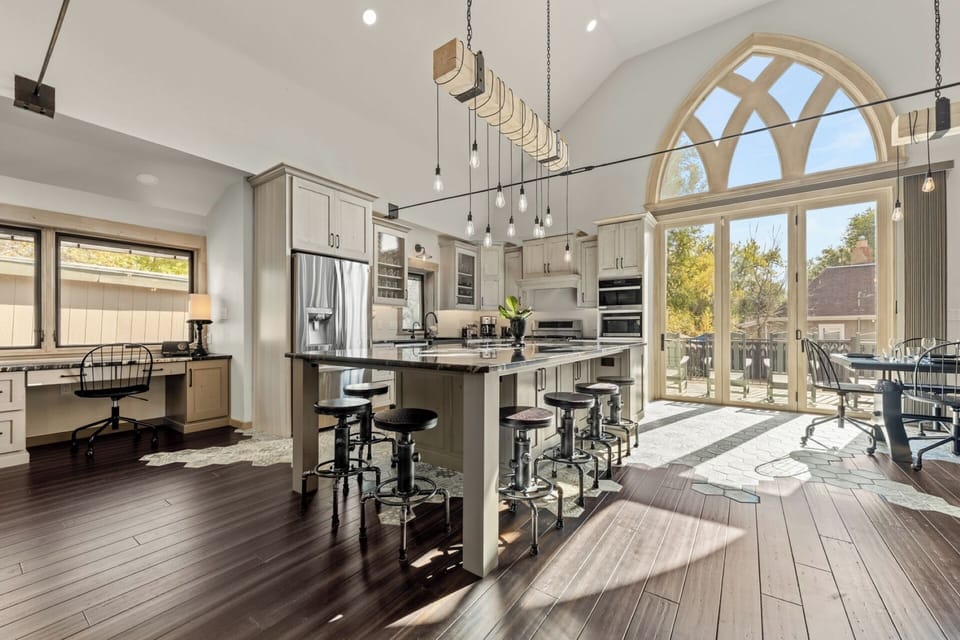 Gourmet chefs kitchen with Brazilian titanium granite island with seating for 7.
