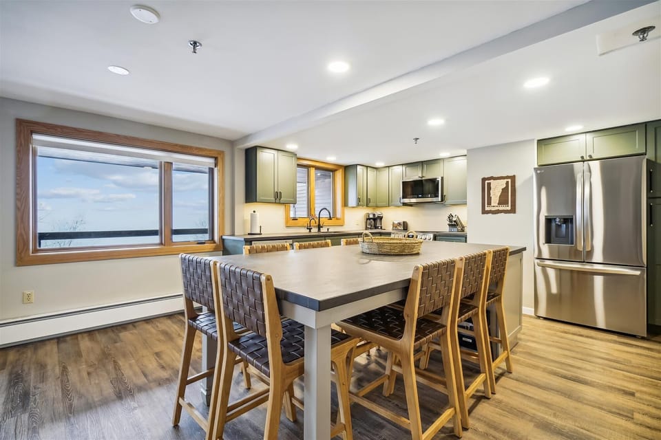 This dining area is so versatile!   Can be used to serve and as a dining table, seats 8.  Beautiful views while you entertain guests or enjoy your home cooked meal.