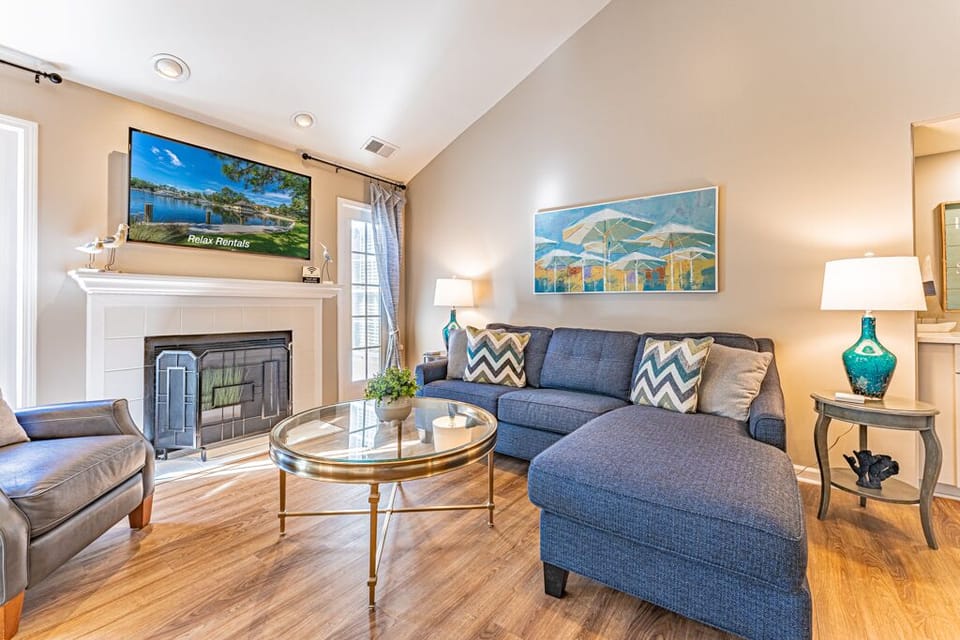 Upon entering, the welcoming living area greets you with vaulted ceilings, a charming fireplace, and a flat-screen Smart TV. 
1 Sleeper Sofa