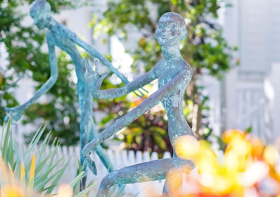 Wander past whimsical sculptures tucked among lush, blooming gardens.