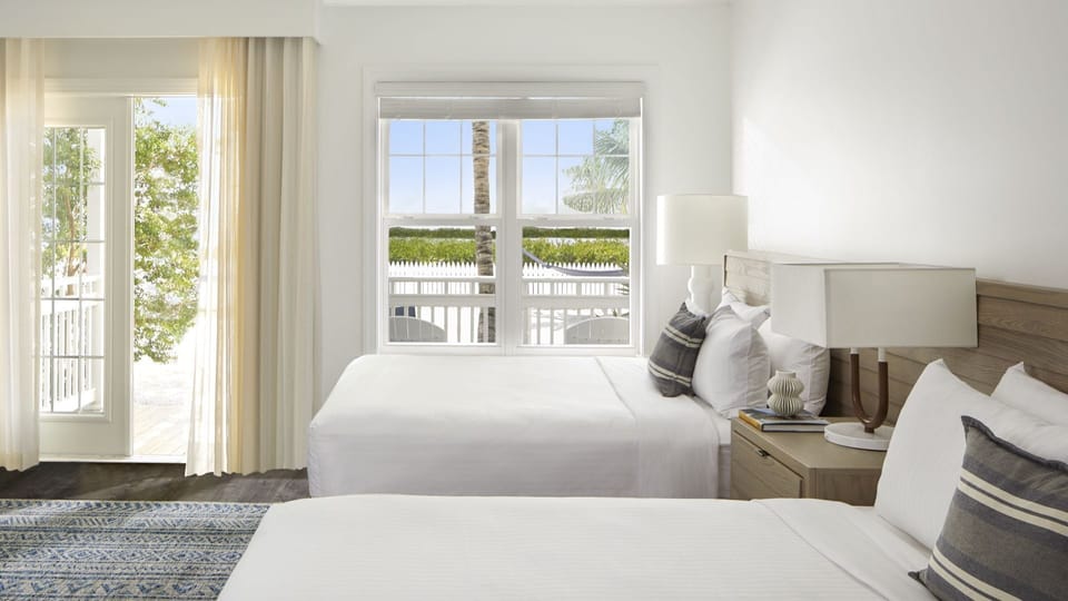 Step onto the patio from bright beds dressed in crisp whites.