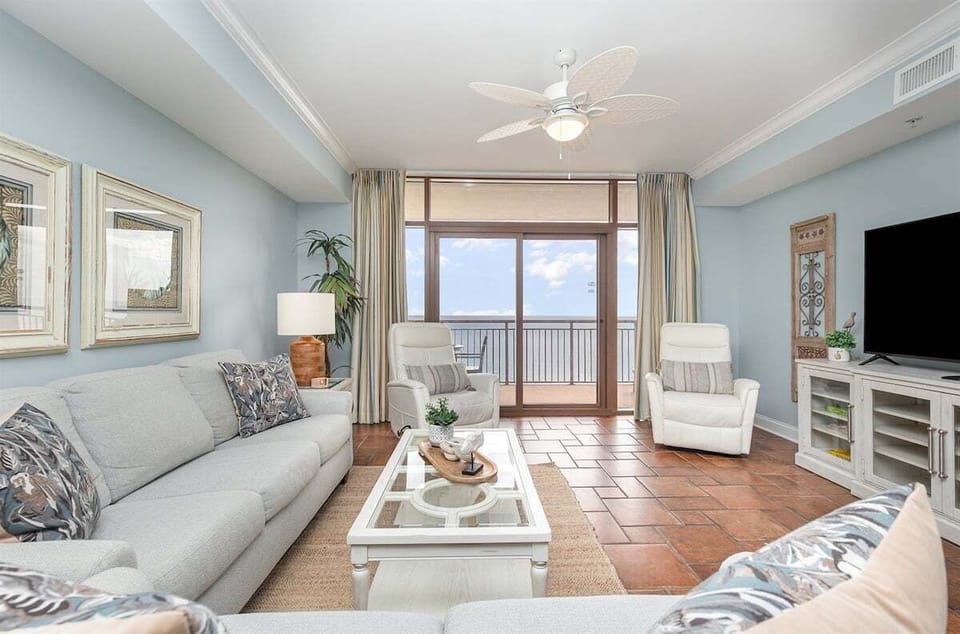 A sun-filled living space with comfy seating and amazing views!