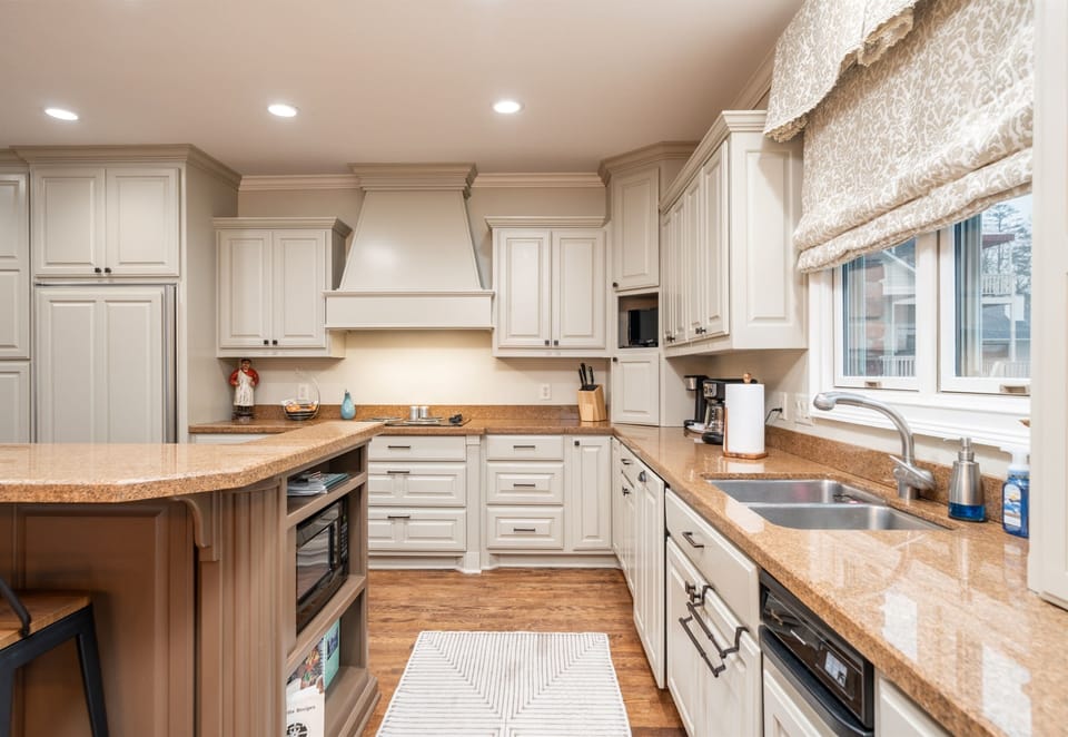 [Kitchen] The Bright and Spacious Kitchen is Filled with Everything you'd Need to Whip Up a Family Favorite.