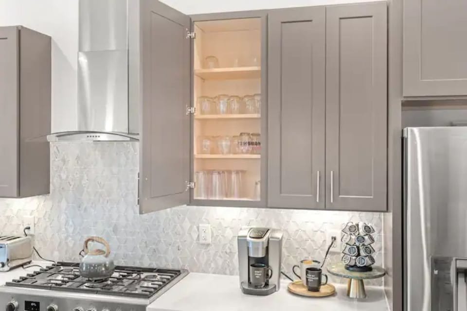 Fully stocked with cups, dishes, utensils, etc. 