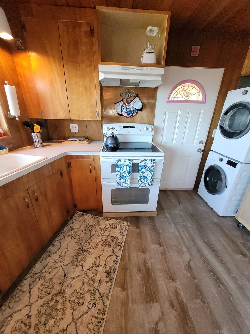 Kitchen with washer and dryer.