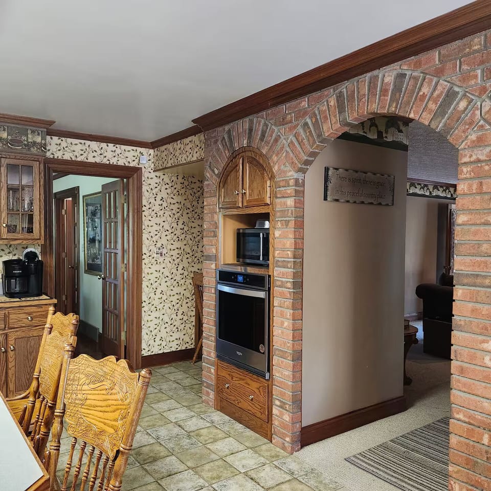 The kitchen leads to the large dining room and main floor living room