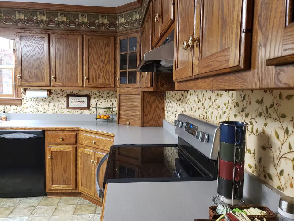 Fully stocked country kitchen with plenty of counter space and dishes