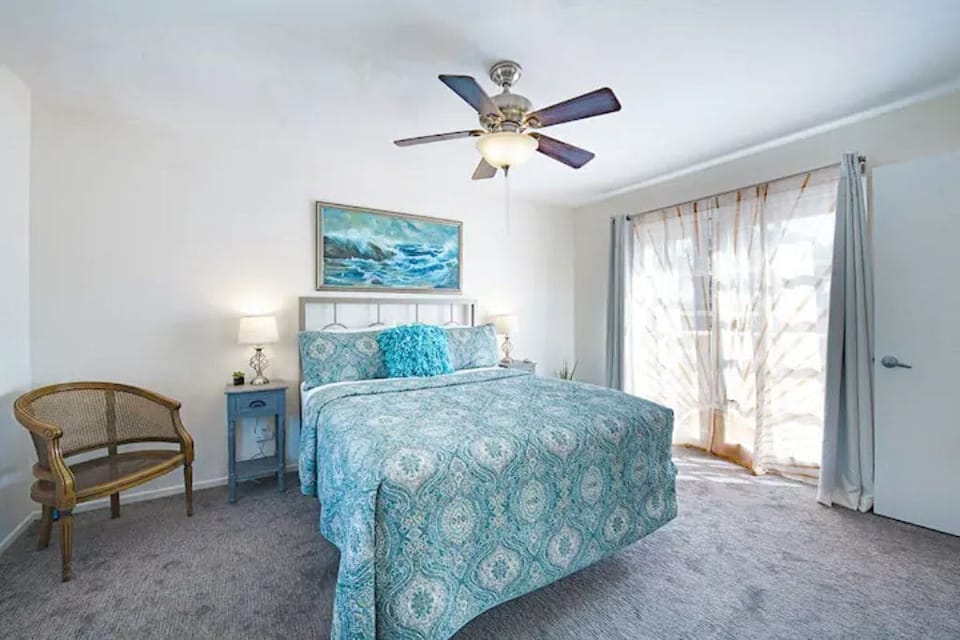 Bedroom 2 features height-adjustable desk, mountain views, private patio entry