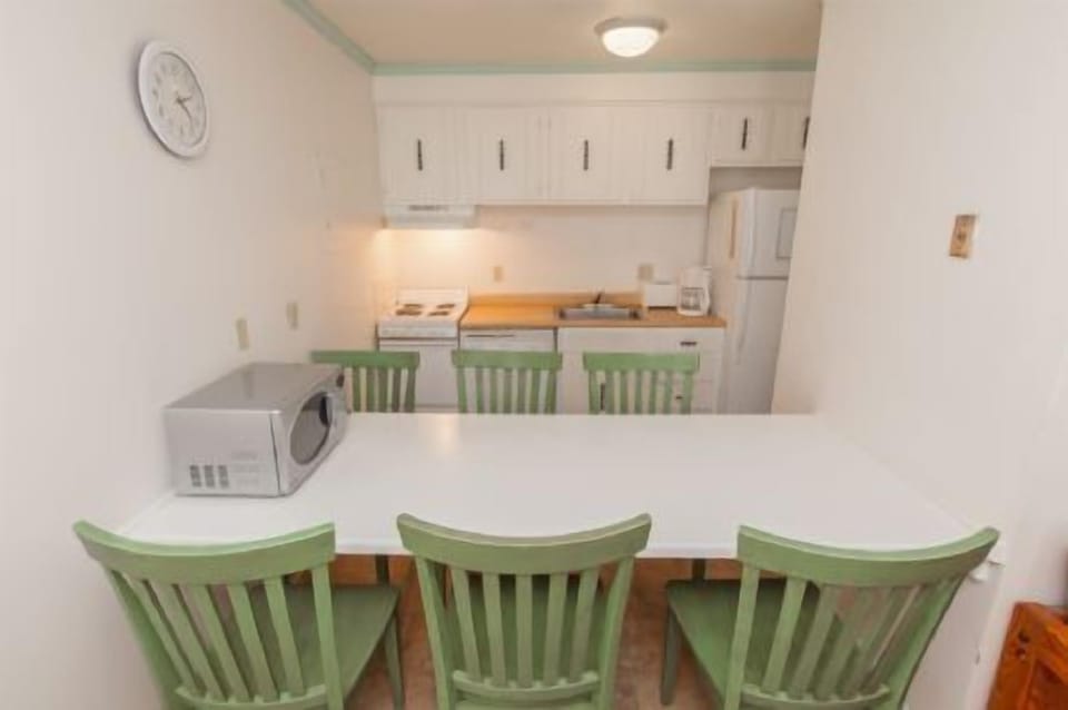 Galley kitchen with eating area