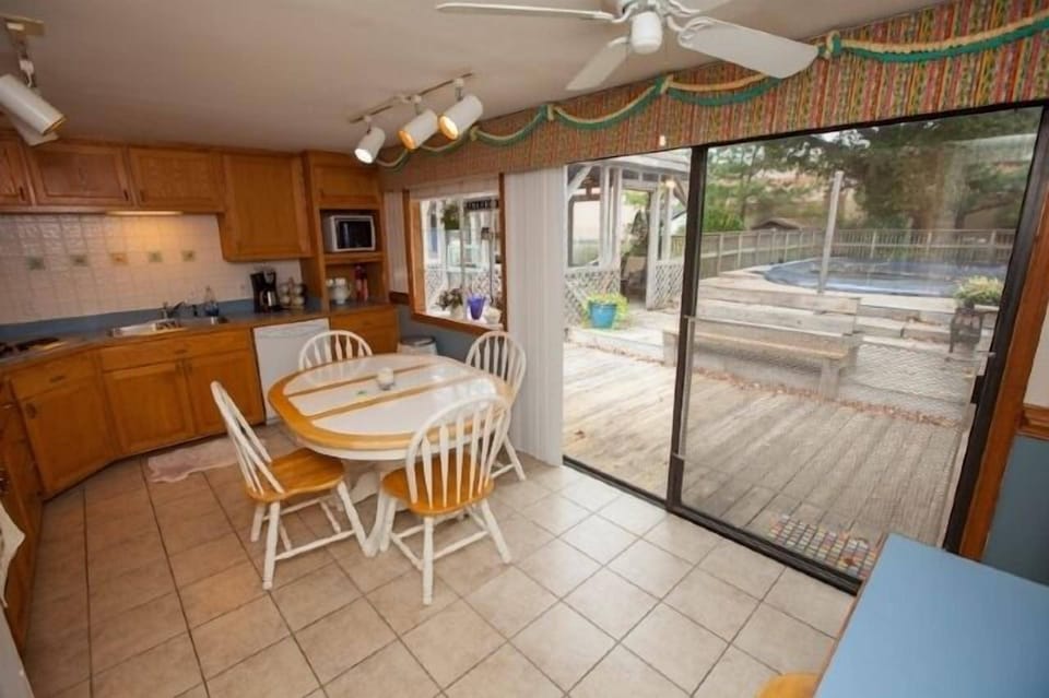 Kitchen with access to deck and pool