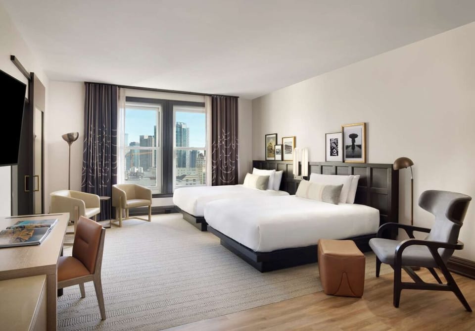 Unwind in airy comfort with two beds and skyline views.