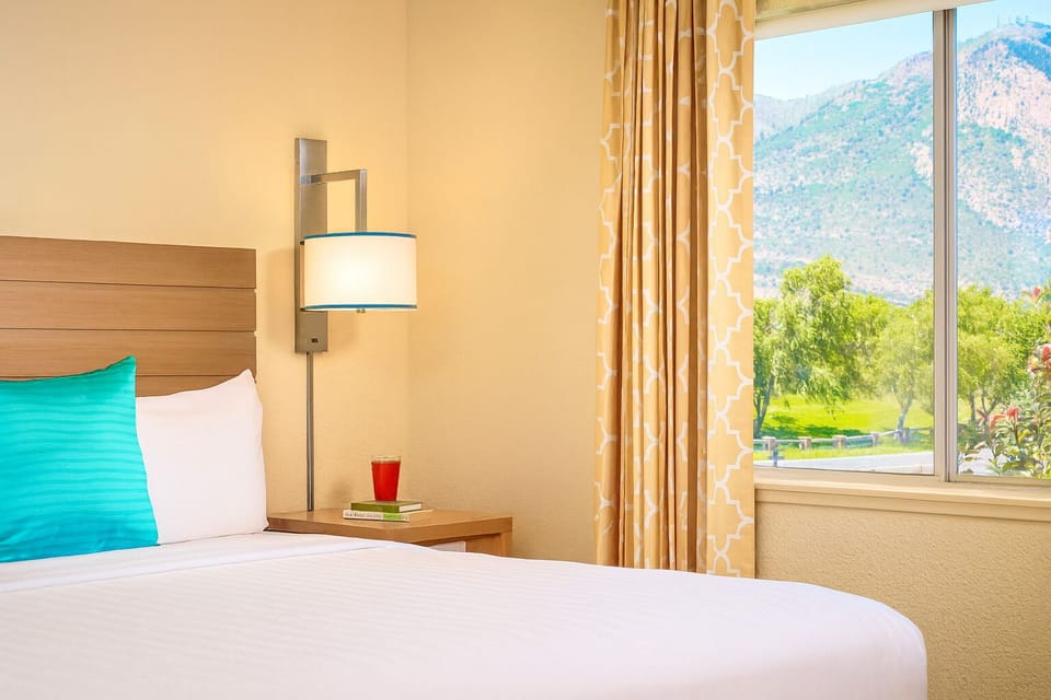 Wake up to sunlit mountain views from your pillow.
