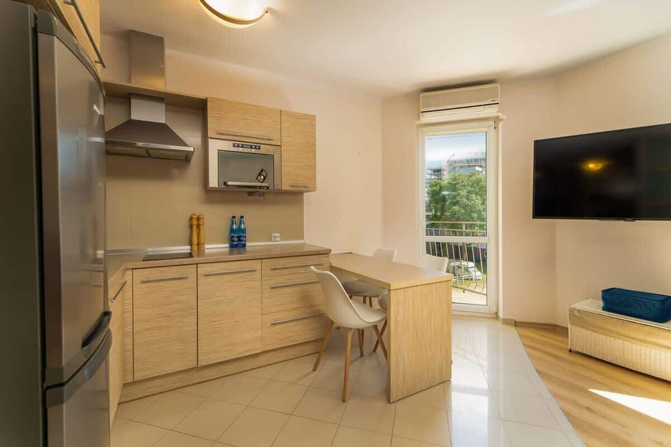 Another perspective of the kitchen and dining space, showcasing its modern appliances and cozy design.
