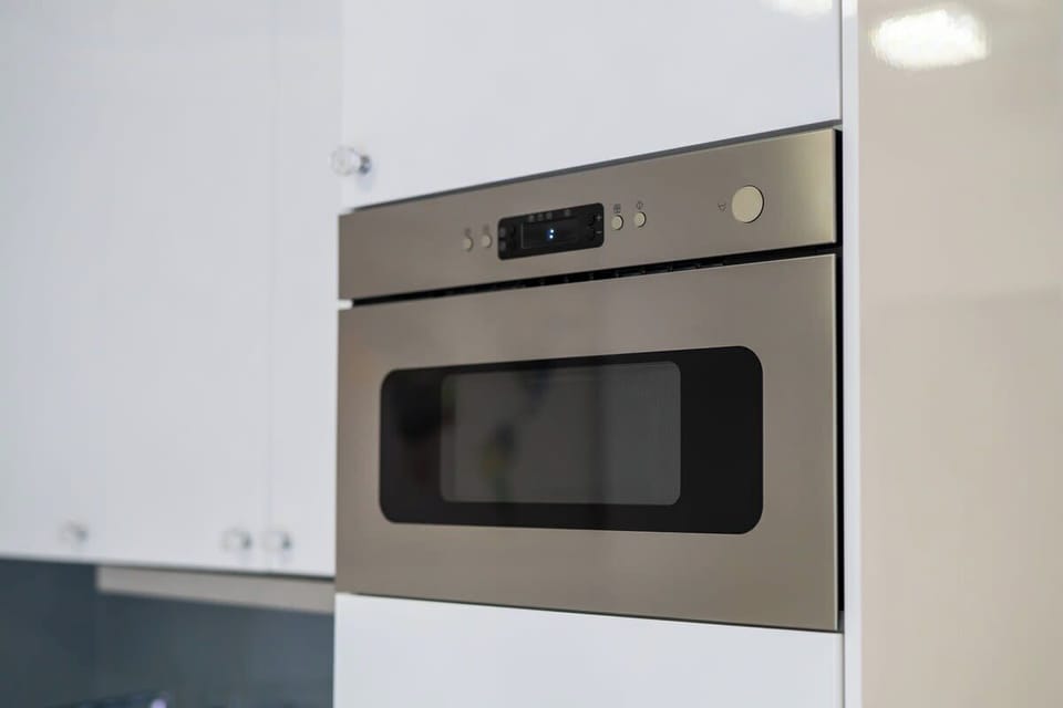 A close-up of a built-in oven in the kitchen, emphasizing the sleek and functional design.
