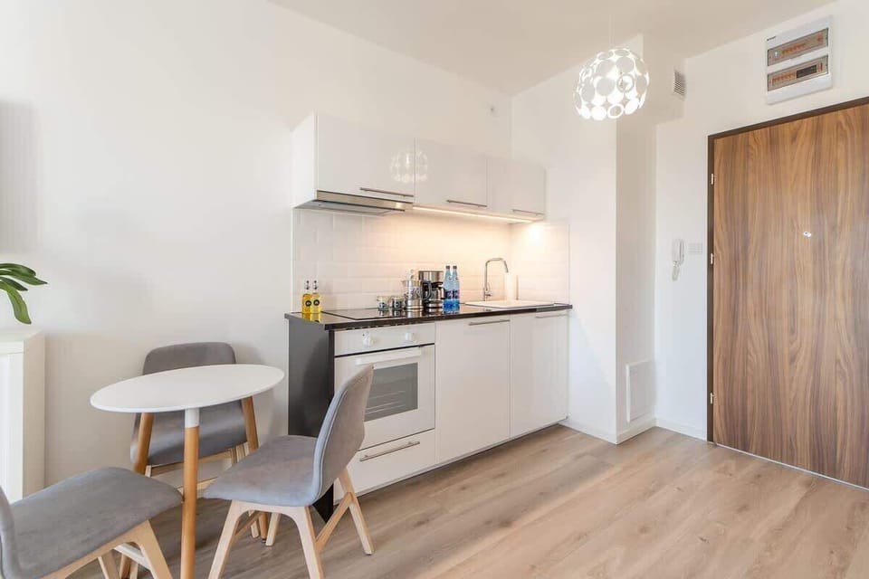 Cook and dine in style with the modern kitchenette and dining area.