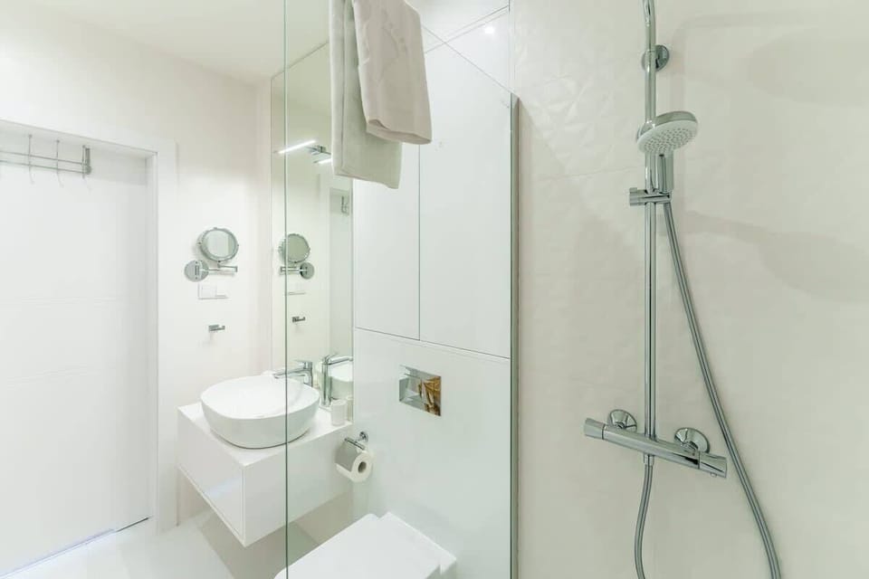 The bathroom offers a clean and functional space for your stay. 