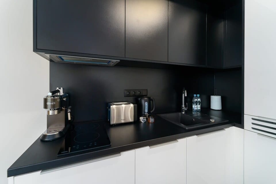 Bright kitchen with cooking utensils. 