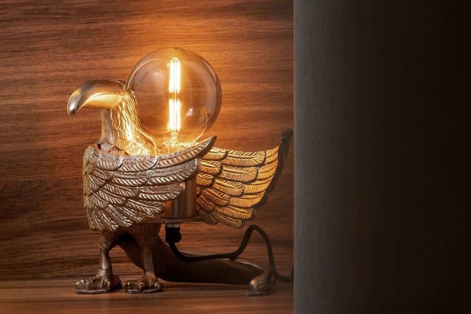 A close-up of a decorative golden lamp with a glass globe, adding an elegant touch to the room.






