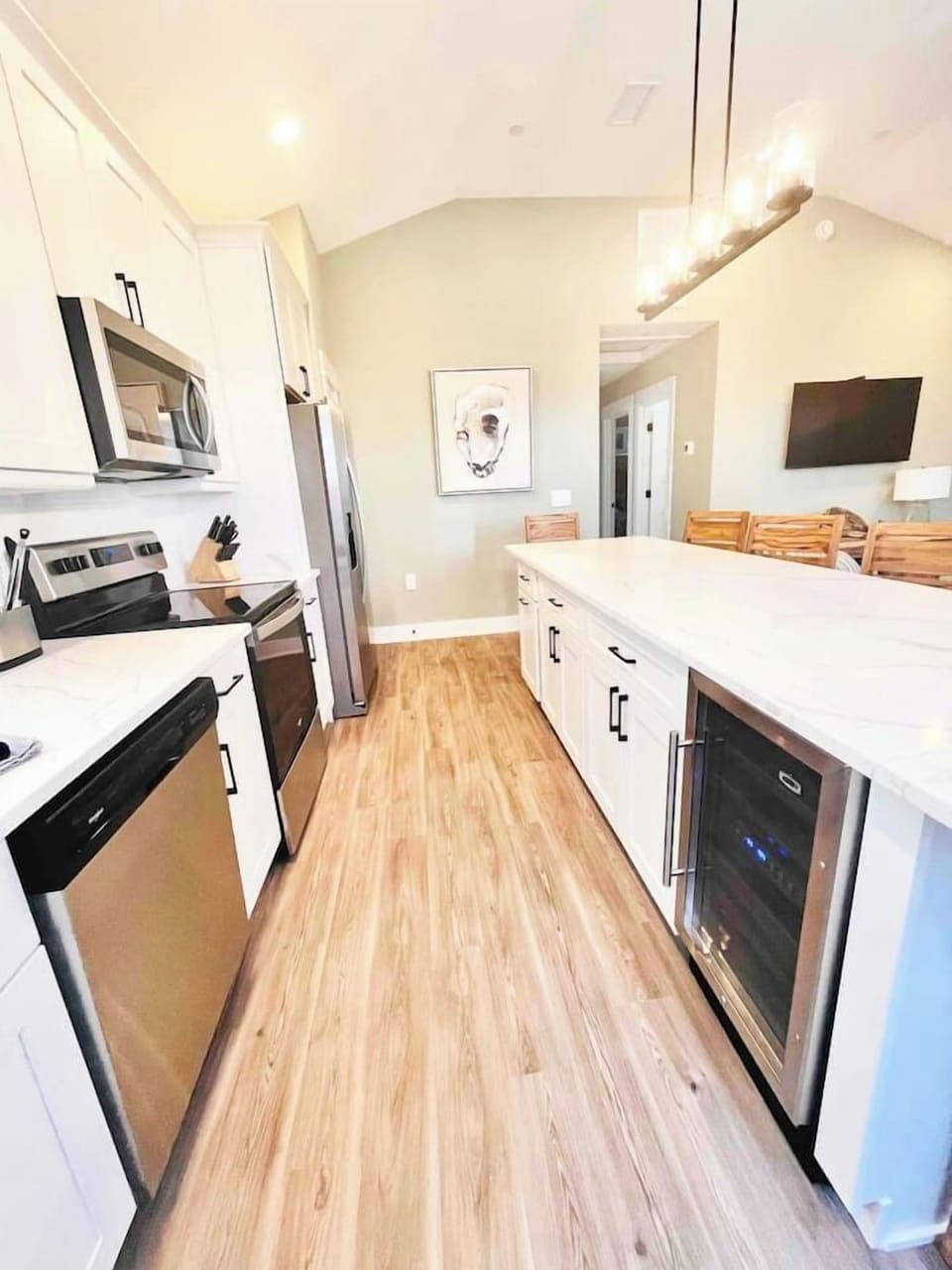 Spacious kitchen with oversized island and modern appliances.