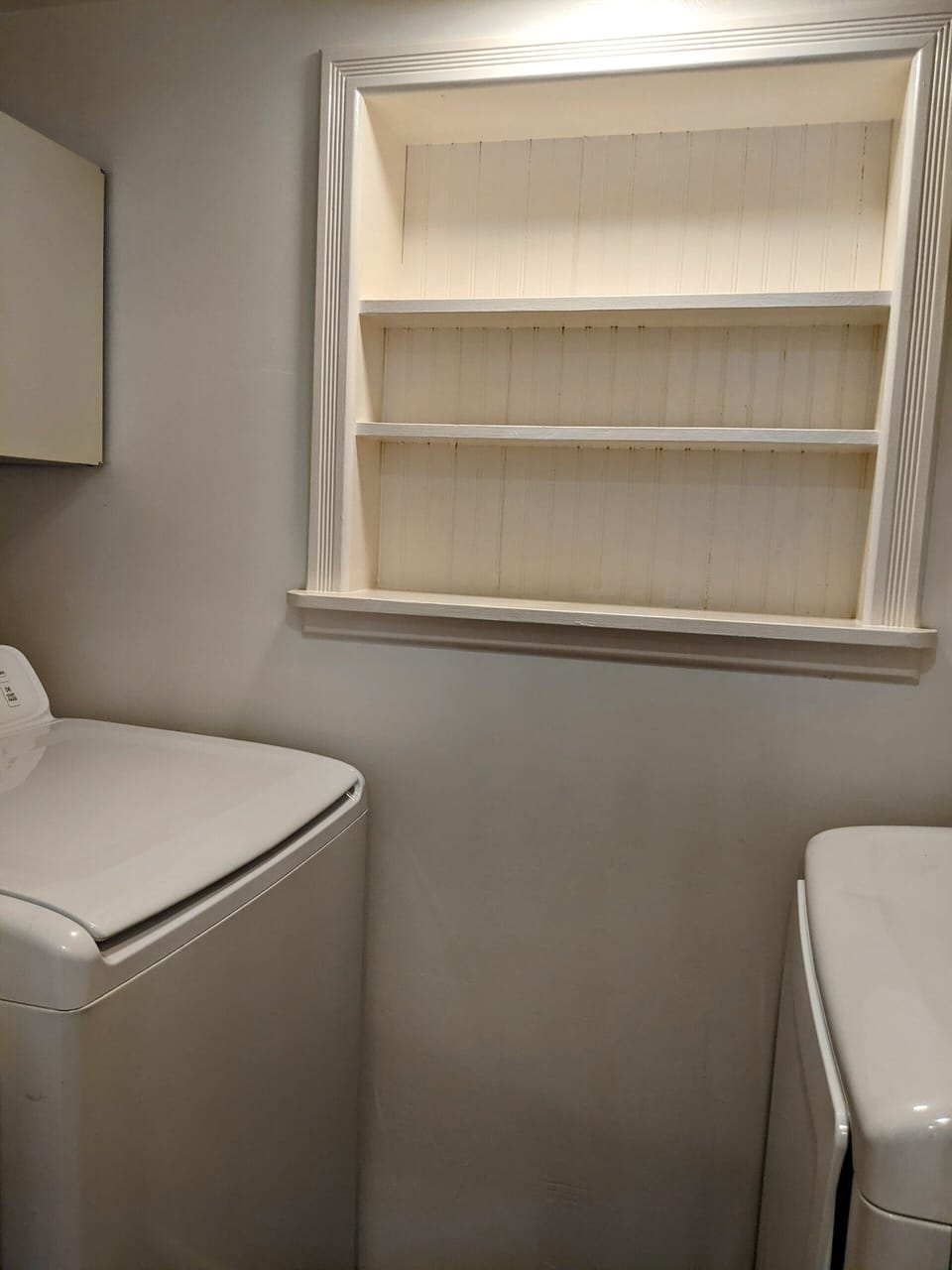 The laundry room is conveniently located off the kitchen.