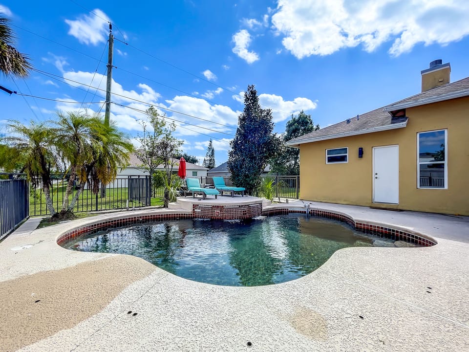 Hang out all day in the Florida sun! Heated Saltwater Pool - Waterfall - Loungers - Patio Seating