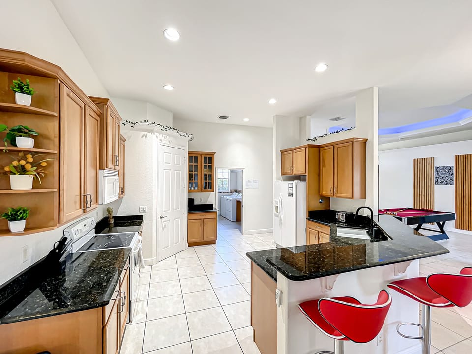 The spacious, full kitchen offers modern amenities, perfect setting to whip up family meals