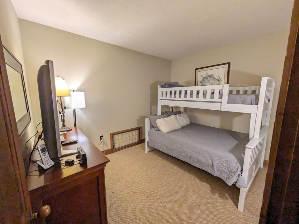 secondary bedroom with television.