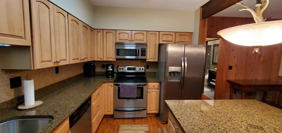 The kitchen has a keurig and traditional coffee maker along everyday essentials.