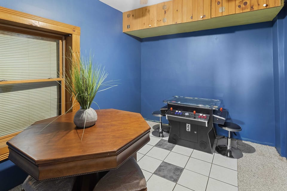 Card Table and Multi-Game Arcade Game in the Lower Level Game Room