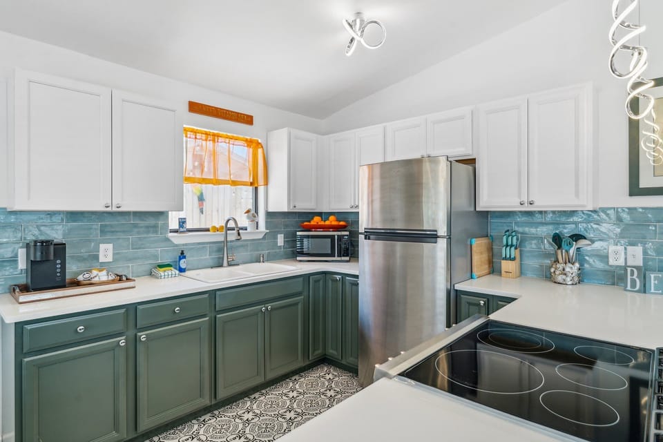 Fully Stocked Kitchen with Stainless Steel Appliances and Bar Seating