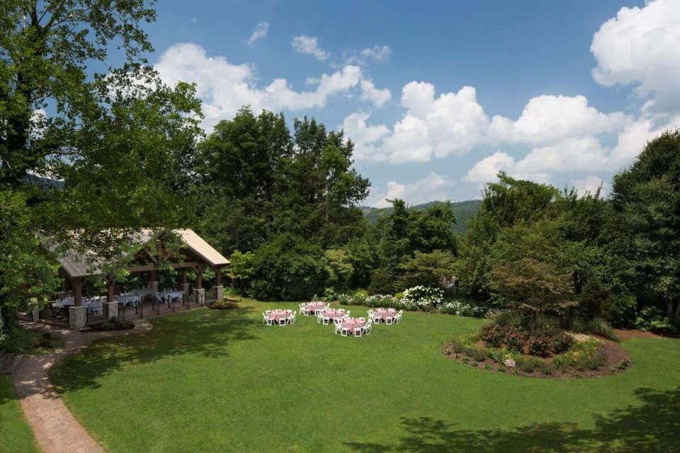 Breathe deep across sweeping lawns framed by lush trees.