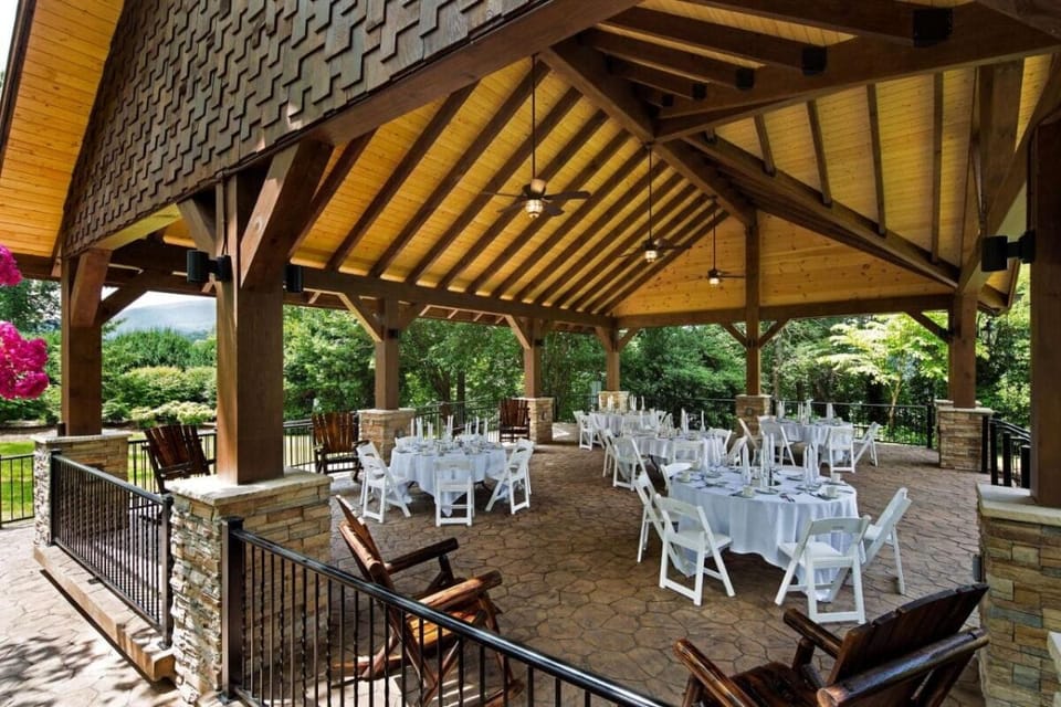 Host relaxed outdoor moments under a warm, timber pavilion.