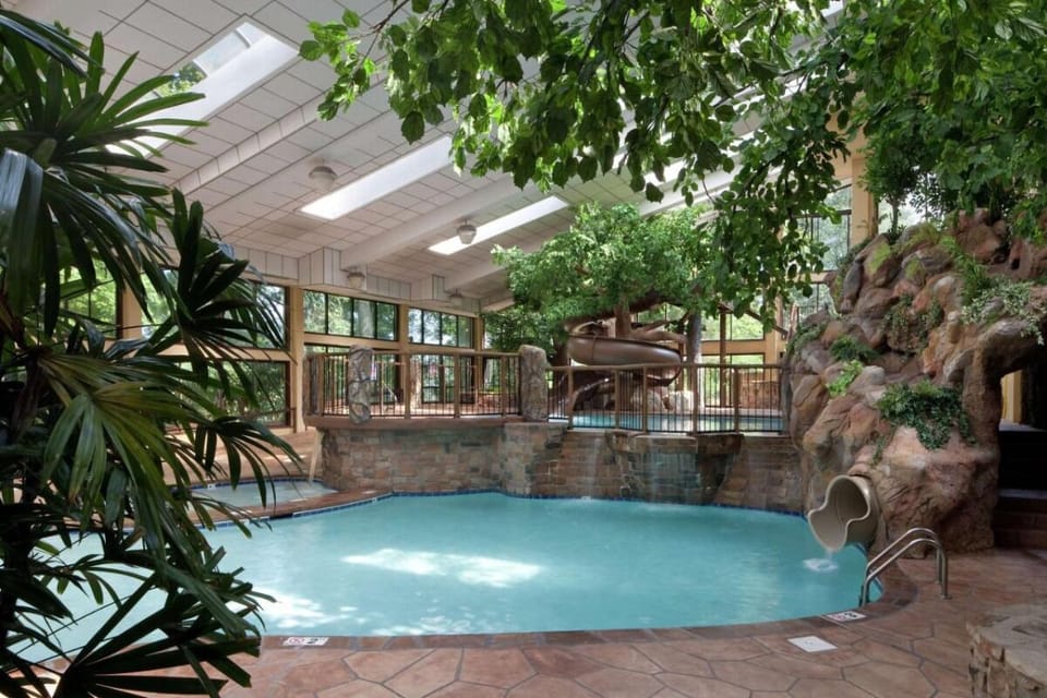 Splash and relax in a tropical-style indoor pool oasis.