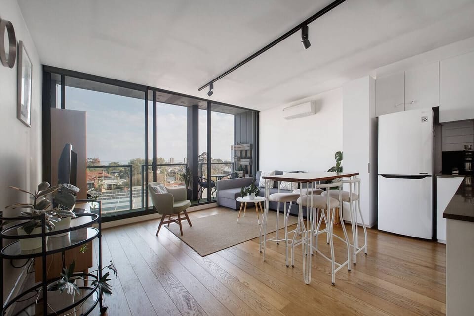 A seamless open flow makes the space feel airy and spacious, with sliding glass doors to let in the cooling breezes. 
