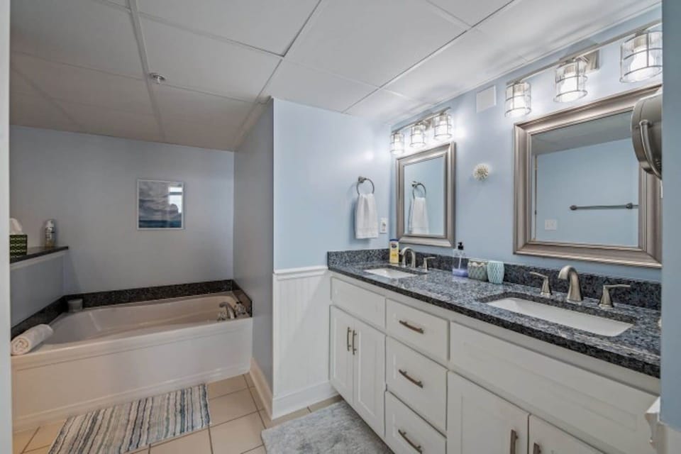 After a fun day on the beach, sink into the soaker tub with a glass of wine.