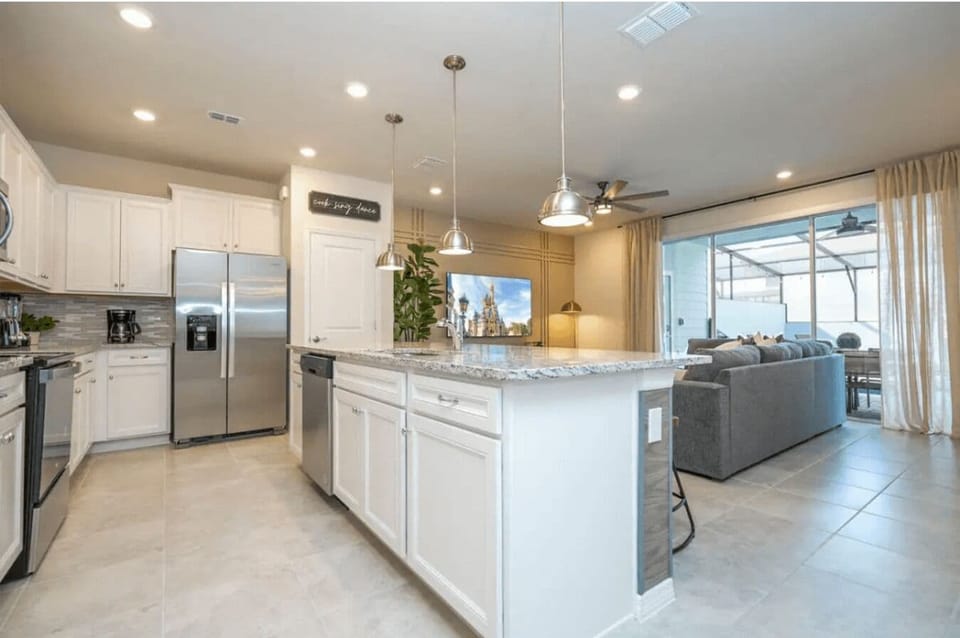 Open living space that seamlessly connects the beautiful kitchen and dining area, offering a perfect blend of comfort and style.