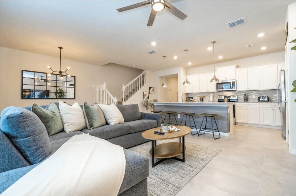 Open living space that seamlessly connects the beautiful kitchen and dining area, offering a perfect blend of comfort and style.
