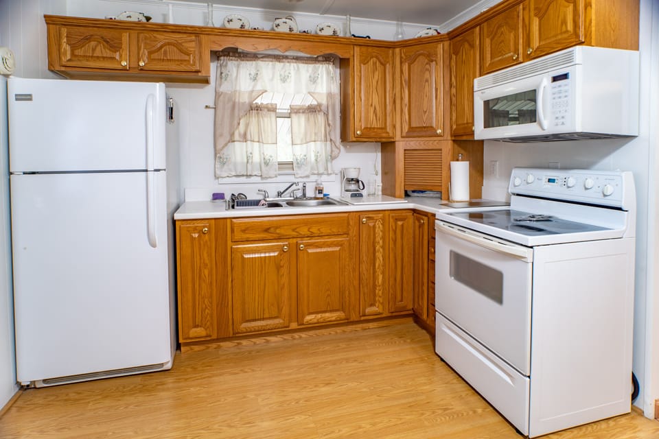 Kitchen with refrigerator, stove, oven, microwave