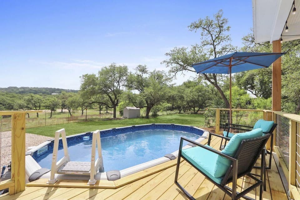 Deck overlooking fenced in back yard