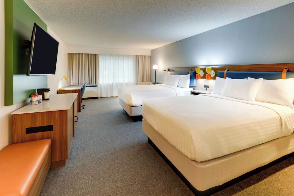 Unwind in a spacious double‑queen room with crisp linens.