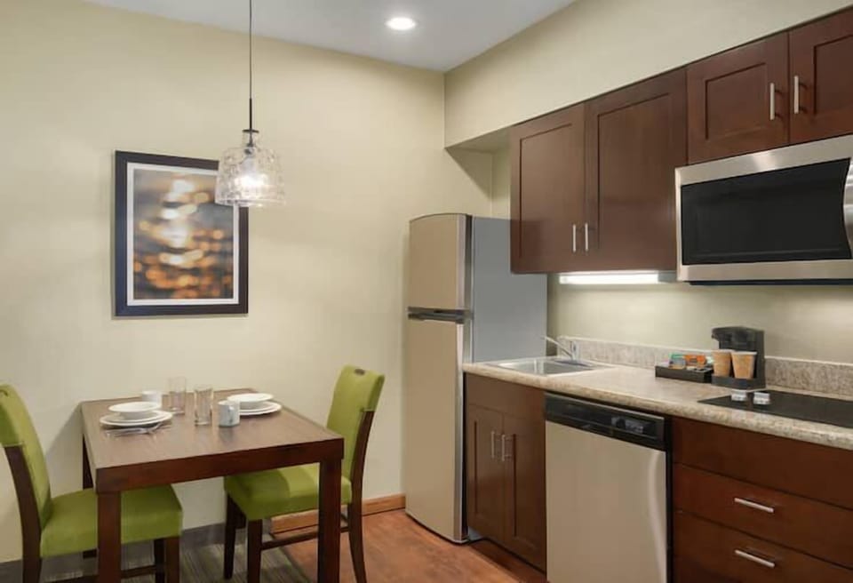 Cook simple favorites with full-size fridge and sleek appliances.