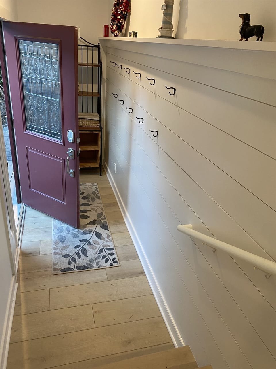 Foyer entrance with coat/hat hooks and cubbies 