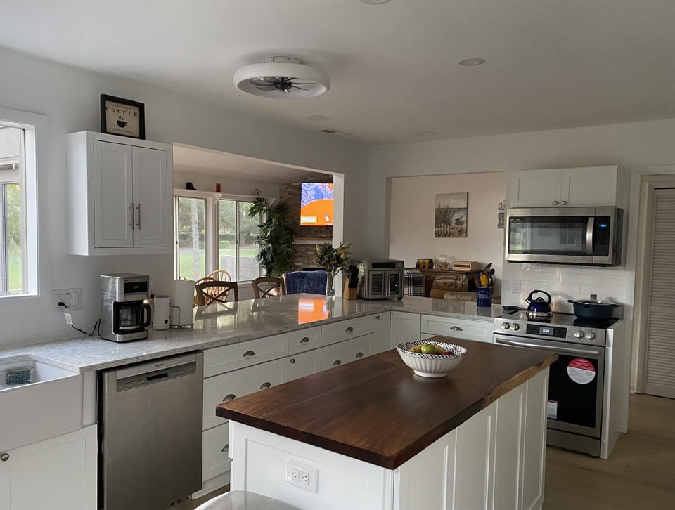 View from kitchen into open DR/FR/LR area 