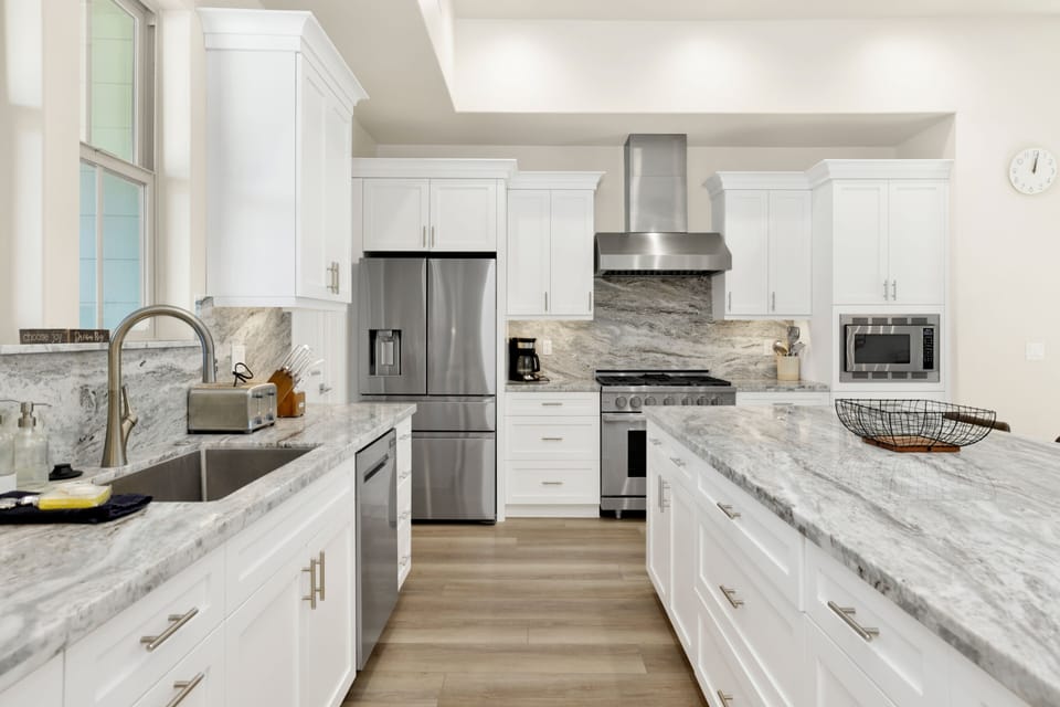 Fully equipped cabin kitchen with ample cabinetry, stove, microwave, fridge, and coffee maker—perfect for cooking meals, morning coffee, and feeling right at home on your stay.