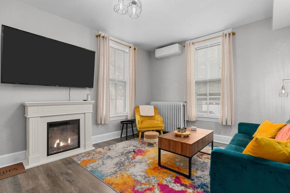 The comfortable and cozy living area has lots of natural light! Relax while reading, visiting or watching tv!